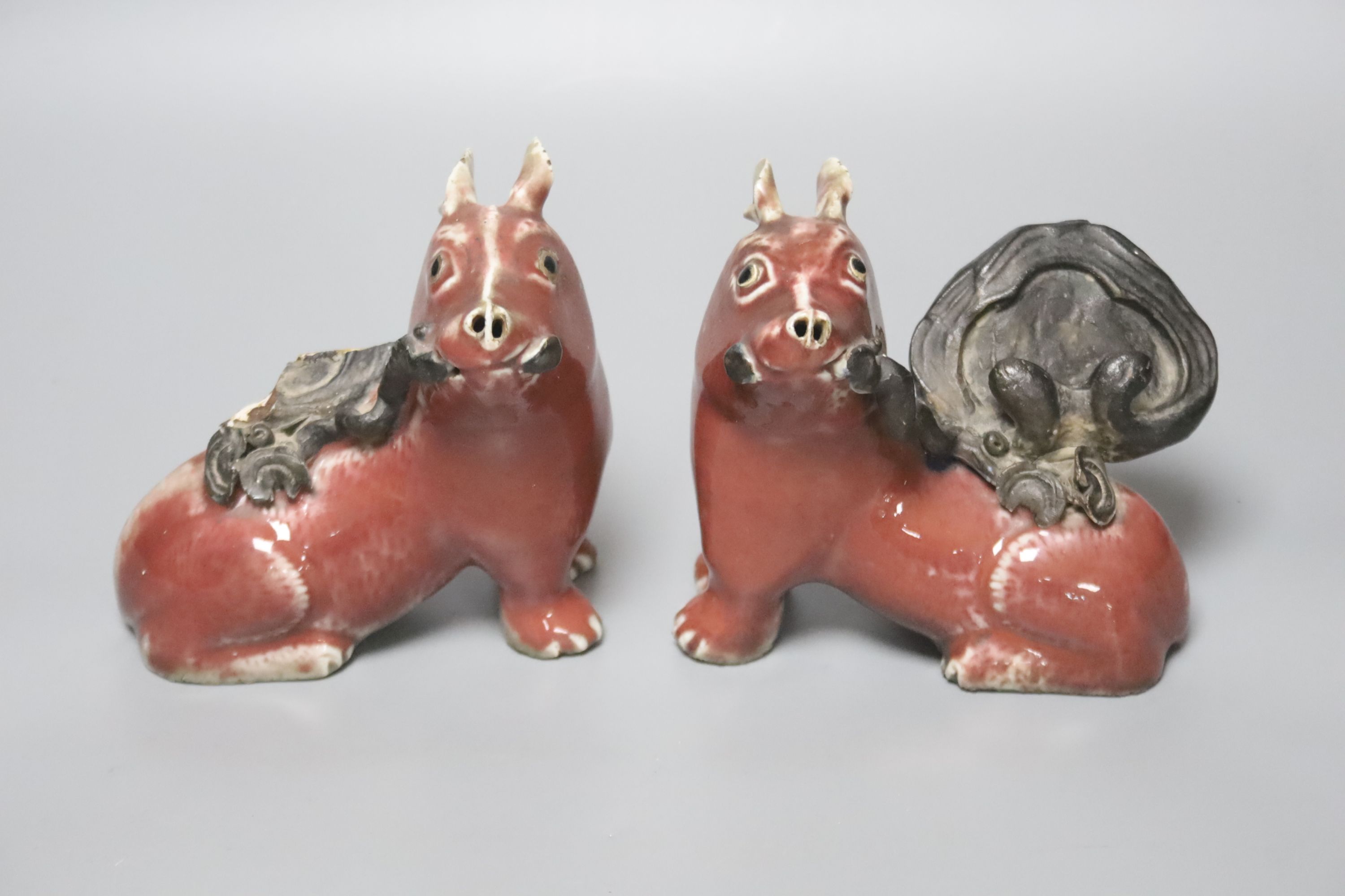 A pair of unusual Chinese copper red glazed pig incense burners/ joss stick holders, late Qing dynasty, height 13cm